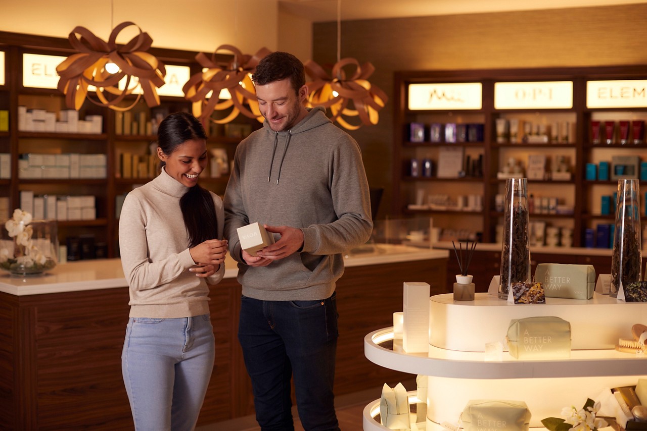 Couple browsing the spa and beauty products available inside the Aqua Sana Boutique.